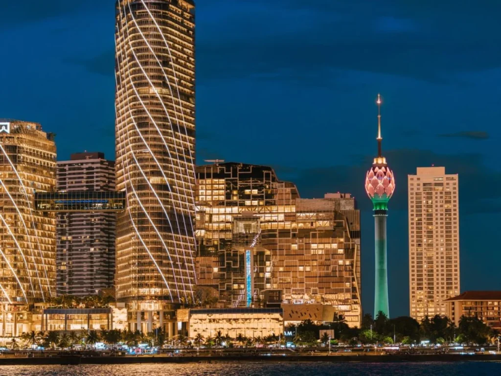 Illuminated Colombo skyline with the Lotus Tower and waterfront buildings at night, Sri Lanka
