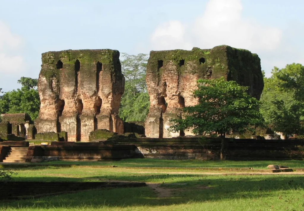Tall weathered brick walls and openings of the Royal Palace ruins at Polonnaruwa, Sri Lanka