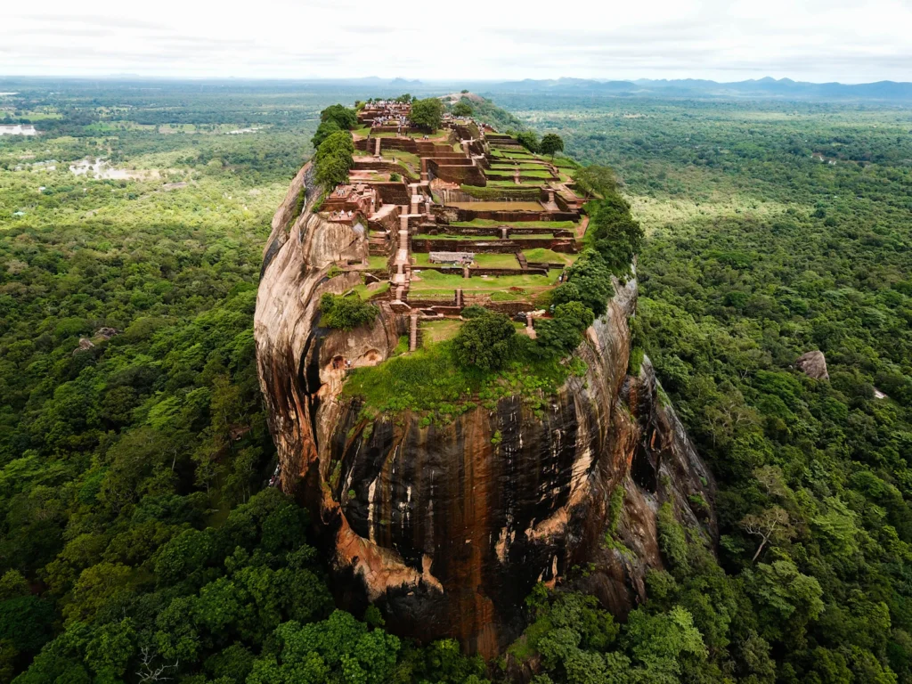 Aerial view of the summit ruins on Sigiriya Rock Fortress above the surrounding forest, Sri Lanka