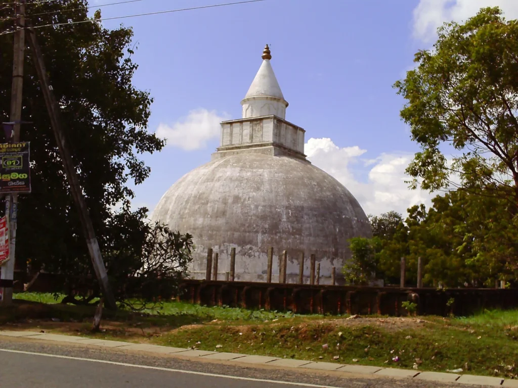 White Yatala Vehera stupa rising above a tree-lined temple compound in Tissamaharama, Sri Lanka